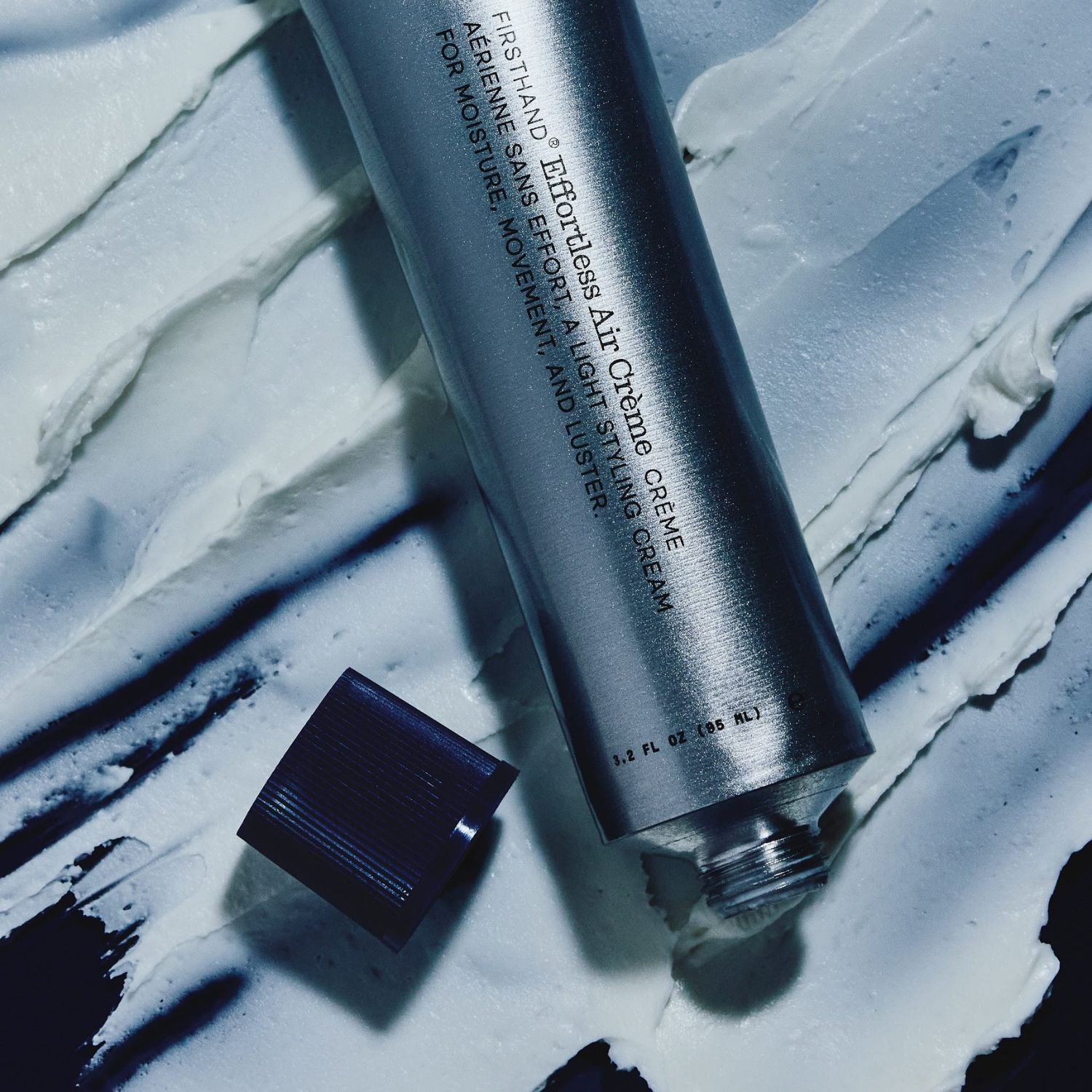 Cosmetic tube and cap on a textured surface