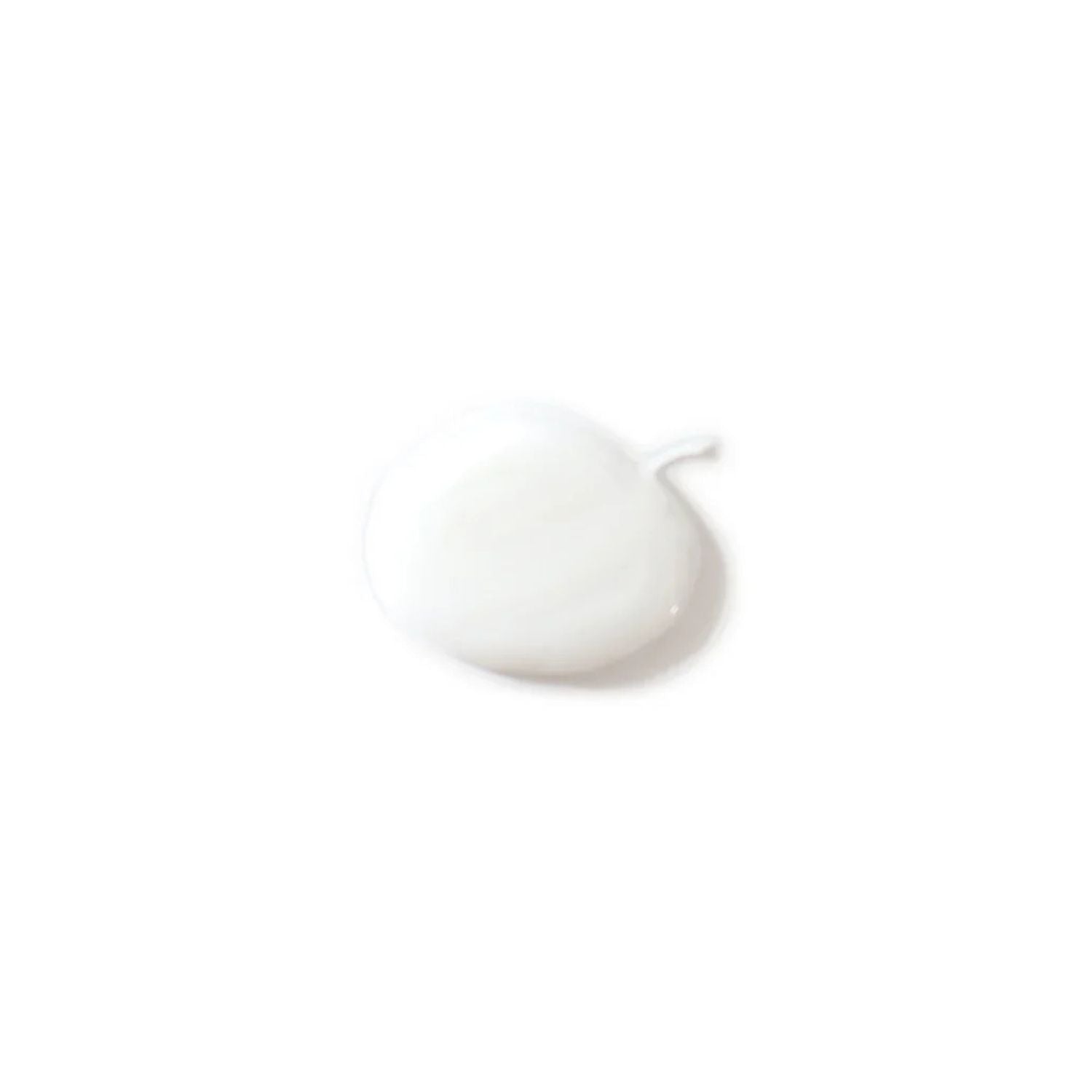A small dollop of creamy white cosmetic product, likely a lotion or cream, on a solid white background.