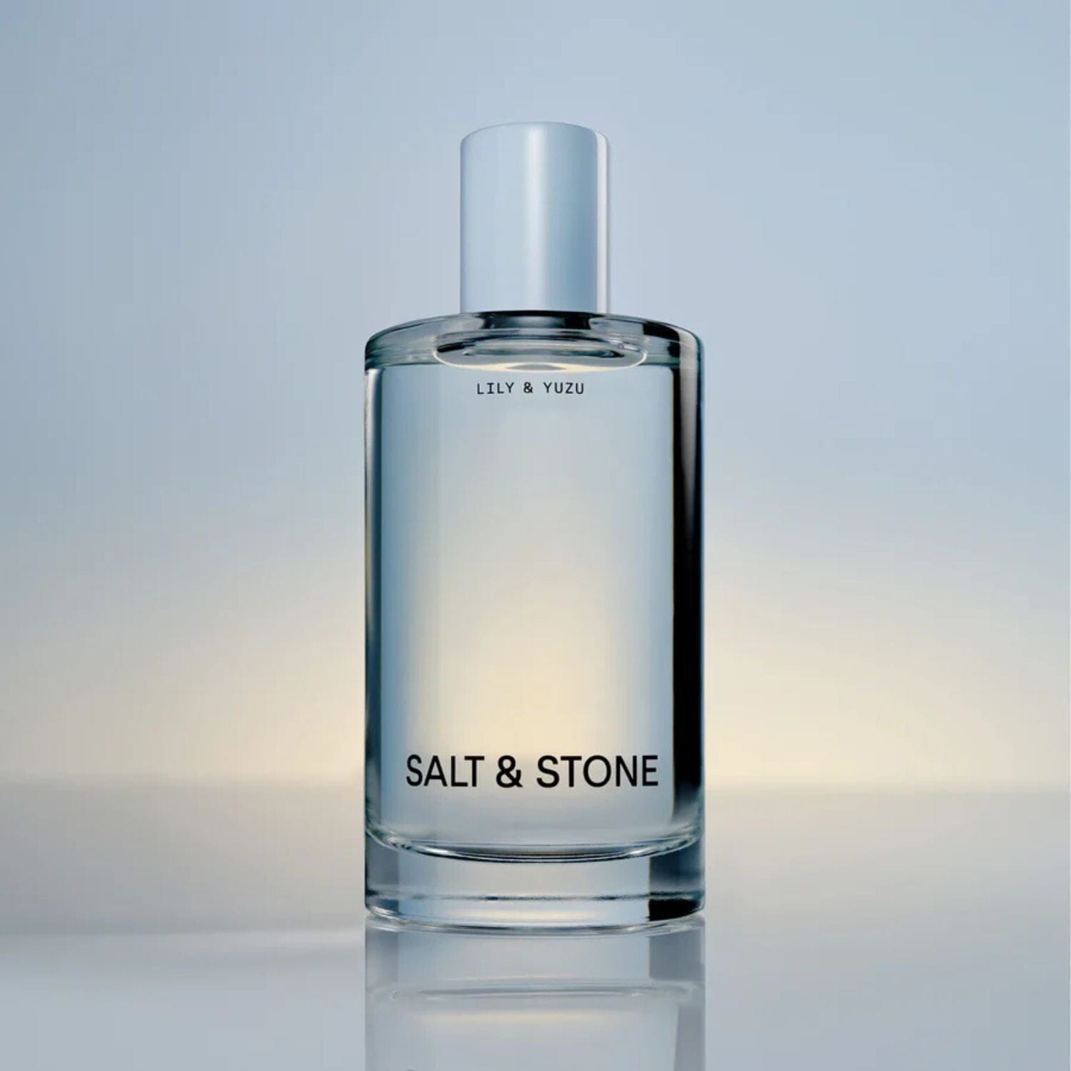 Bottle of Salt and Stone Body Mist on a light background
