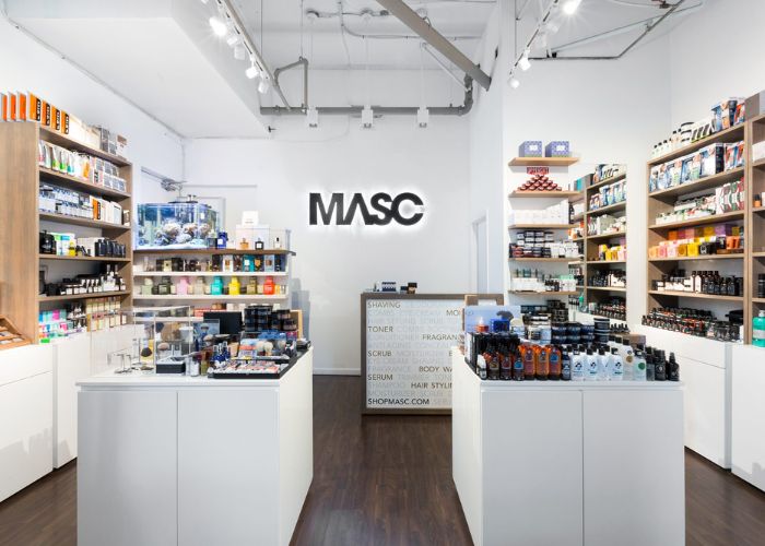 MASC store interior with shelves stocked with products and a counter.
