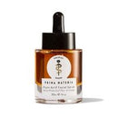 A small clear glass bottle with amber liquid and a black dropper cap, labeled 'Prima Materia' on a white background.