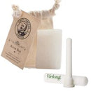 A white alum block and a styptic pencil, shown with a beige drawstring pouch and a vintage-style Vie-Long tag on a white background.