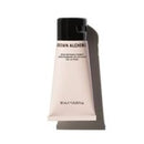 A squeeze tube of Grown Alchemist Skin Primer with a black cap, shown on a clean white background with a prominent cast shadow.