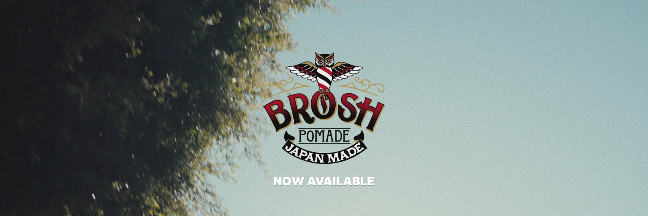 Brosh pomade logo with text saying now available with a tree and blue sky in the background