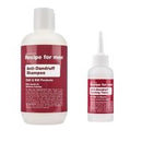 Two white plastic bottles of pet grooming products on a white background: a larger bottle labeled 'Recipe for men Anti-Dandruff Shampoo' and a smaller bottle labeled 'Recipe for men Dandruff Tonic'.