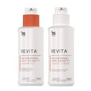 Two white bottles of DS Revita hair care products, one with an orange cap and one with a white cap, shown on a plain white background.