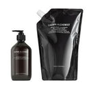 A dark brown bottle hand wash next to a large black refill pouch of Grown Alchemist gabd wash 
