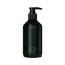 Dark green hand wash bottle on a white background