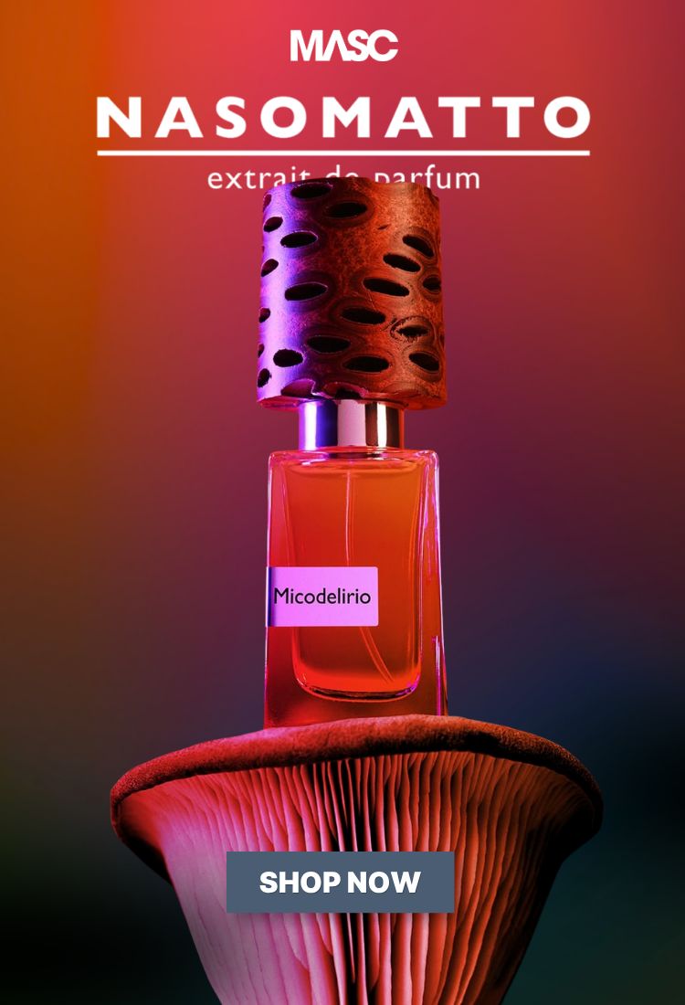 MASC Nasomatto Micodelirio perfume bottle with a distinctive mushroom-shaped base and perforated cap, set against a dark gradient background with orange and purple lighting. The image includes 'MASC NASOMATTO' branding at the top and a 'SHOP NOW' button at the bottom.