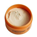 A round orange jar filled with a thick off-white cream or balm, photographed on a plain white background. The front of the jar shows the brand name 'FIRSTSTAND' in black text.