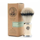 Shaving brush with Captain Fawcett's packaging on a white background