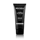 A black squeeze tube of Brickell SPF Face Moisturizer on a clean white background with a subtle reflection underneath.