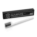 Marvis toothbrush and packaging on a white background